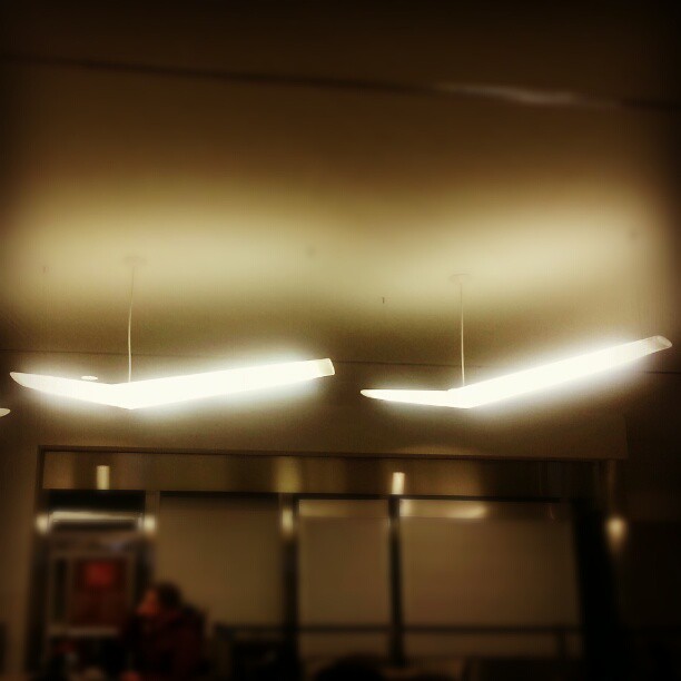 Wing-shaped lights in the @porterairlines lounge at Billy Bishop Airport in Toronto.